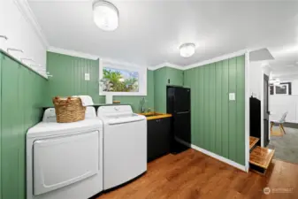 Mudroom and laundry space leads to garage