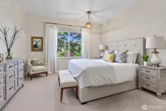 Master bedroom suite with a walk in closet and a 5 piece bathroom.   Virtually staged photo.