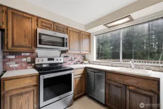 Kitchen overlooks back yard