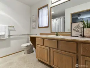 main level full bath , oversize bath tub, wide door + grab bars