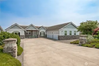 Great parking with RV or boat parking next to the garage. Gravel parking on the street as well. Cement roof.