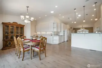 Dining room area just off the kitchen. See all the cabinets this home has to offer. under cabinet and floor lighting as well.