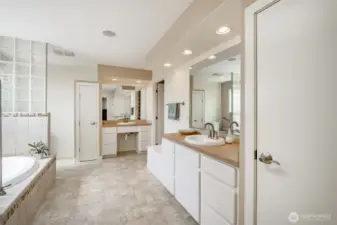 Separate shower, soaking tub, double separate vanities, water closet, linen closet and walk-in closet.