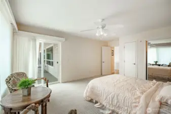 The other guest bedroom on the main level with access to the deck. Walk-in closet just outside this room.