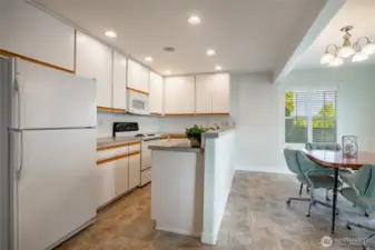See kitchen and dining areas.