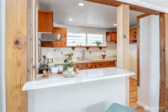 Love this eat-in bar and this sunny kitchen!
