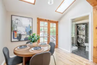 The dining room gets lots of light with the skylights and french doors close by.