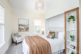 The second bedroom is darling with a flexible nook for your bed to fit in or use as a closet.