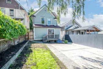 The backyard has ample space and is a blank canvas.
