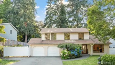 Welcome home to this beautifully maintained Bellevue gem! Nestled on a quiet street, this charming two-story residence features a spacious driveway, lush landscaping, and a welcoming front entry.