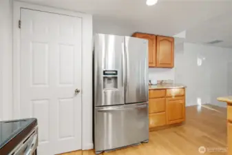 A spacious pantry, along with extra cabinetry and generous counter space, makes meal prep effortless and adds everyday convenience.