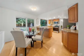 Enjoy casual meals in the light-filled eating space just off the kitchen, where sliding doors open to the backyard—perfect for indoor-outdoor entertaining or a quiet morning coffee with a view.