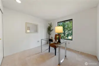 Bedroom Three: Currently staged as a home office, this flexible bedroom is ideal for remote work, a reading room, or your next great hobby space—with great light and a tranquil view.