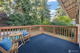 Step outside from your Primary Suite onto a private deck overlooking the backyard—perfect for morning coffee, evening wine, or simply enjoying the surrounding greenery in peace.