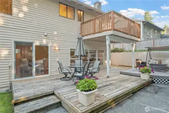 The generous lower deck seamlessly connects to indoor living spaces—perfect for hosting summer barbecues or enjoying quiet mornings.