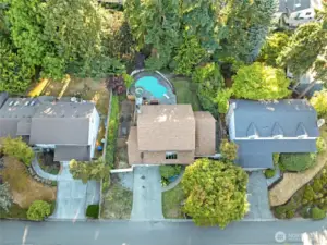 This aerial view showcases the home’s impressive footprint and well-proportioned lot, offering a clear look at the layout, driveway space, and surrounding neighborhood.