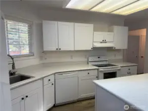 Window at the sink. Lots of counter space and newer cabinets.