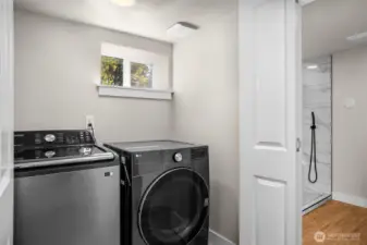 New laundry room w/ washer and dryer.