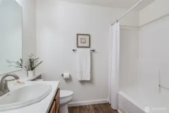 New toilet and flooring in this bathroom.