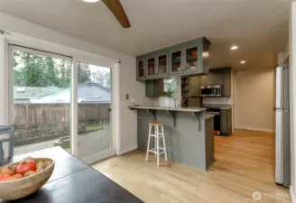 Kitchen and dining area have direct access to the backyard.