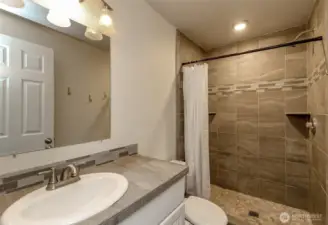 Private primary bath with walk in shower.