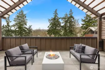 The sunny, covered deck with fire pit extends living and entertaining outdoors