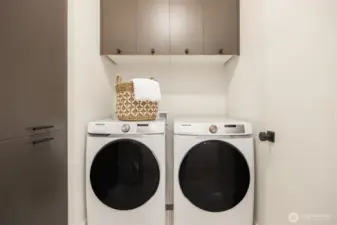 Thoughtfully placed laundry with storage on the second level