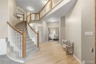 Architectural drama meets livable luxury in this stunning foyer.