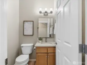 Powder room conveniently located on first floor.