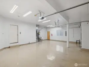 Huge three car garage with durable epoxy floors.