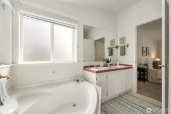 En-suite bath with large soaker tub and stand up shower