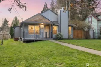 Evening light highlights the home’s welcoming presence and updated exterior finishes.