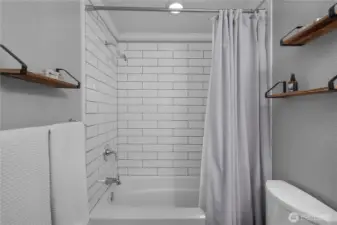 Subway tile tub surround adds a clean, classic finish to the bathroom.