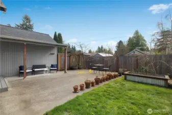 Spacious patio offers the perfect setting for outdoor dining, gardening, or relaxing.