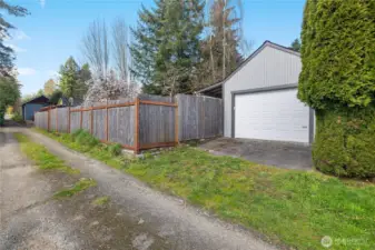 Rare alley-access garage provides practical parking and extra storage options.