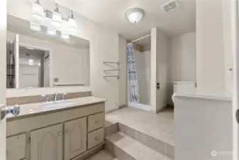 Large 2nd Bath on ground level floor is tiled with electric forced air heat.