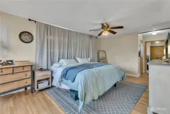 The primary bedroom is very large and has a window seat to the left (not in the picture) and down the hall is the closet and 1/2 bathroom.