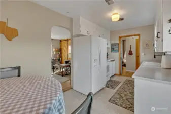 The kitchen is bright and is equipped with a dishwasher, range, refrigerator, microwave and view of the backyard! There is so much natural light!