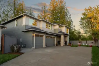 Long driveway to 3 car garages.