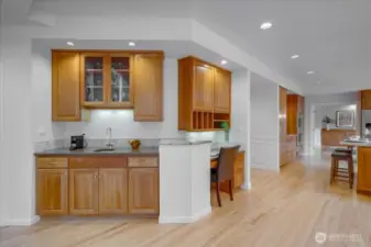 Additionally in this area there is a planning desk and beverage/coffee bar with a sink and refrigerator.