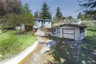 The House and Garage face Fir Street.  The vacant portion of the parcel faces P Street on the left.