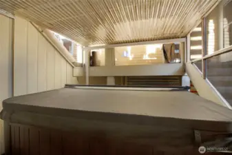 Enjoy soaking in this covered hot tub year round