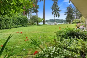 A spacious lawn leads to seating area toward ferry