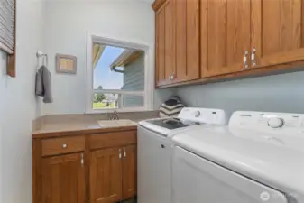Laundry on main level with utility sink.