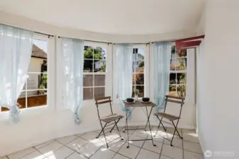Bright sunroom perfect as a dining area or casual breakfast nook.