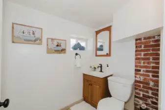 Convenient half bath located in the finished basement.