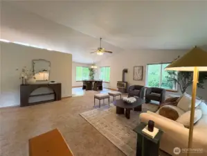 Spacious open layout greets you from the front door—living, dining, and bedroom access all in view.