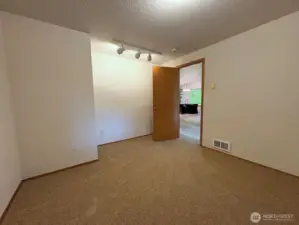 Bonus room off the entry—ideal as a den, office, or pet space with cattery access.