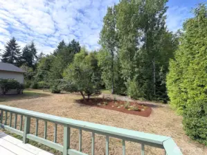 Spacious back deck—ideal for summer barbecues, morning coffee, or simply soaking in the garden views.