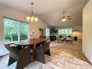 Dining area opens seamlessly into the vaulted living room—perfect for gatherings and everyday living.